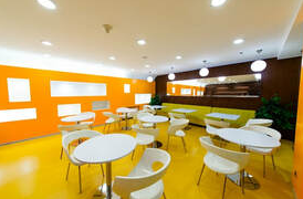 Cafeteria inside a plant in Drummondville. The walls are brightly colored and the place is very luminous. Work executed by Peintre Drummondville.